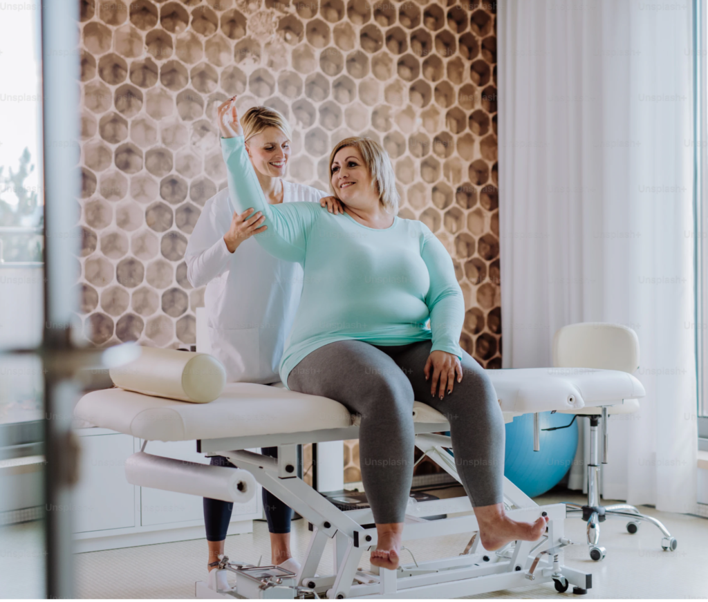 chiropractor helping an obese woman